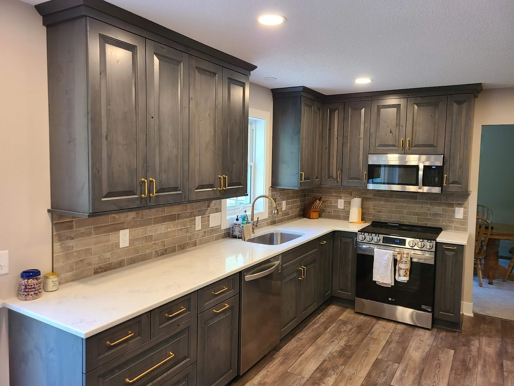 Rustic alder wood kitchen with warm cabinetry and a large island.