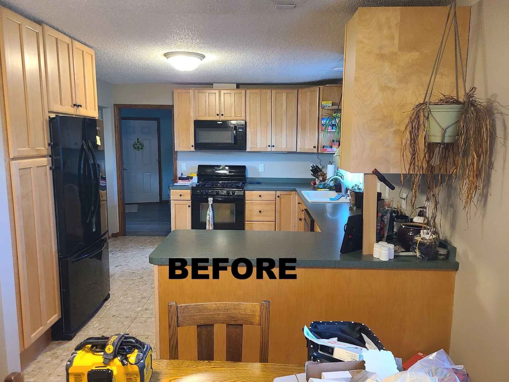 Before: enclosed kitchen with a peninsula
