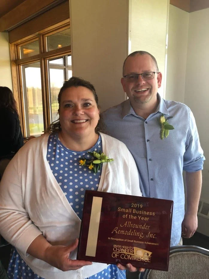 Ruth and Eric Bader holding their Small Business of the Year award