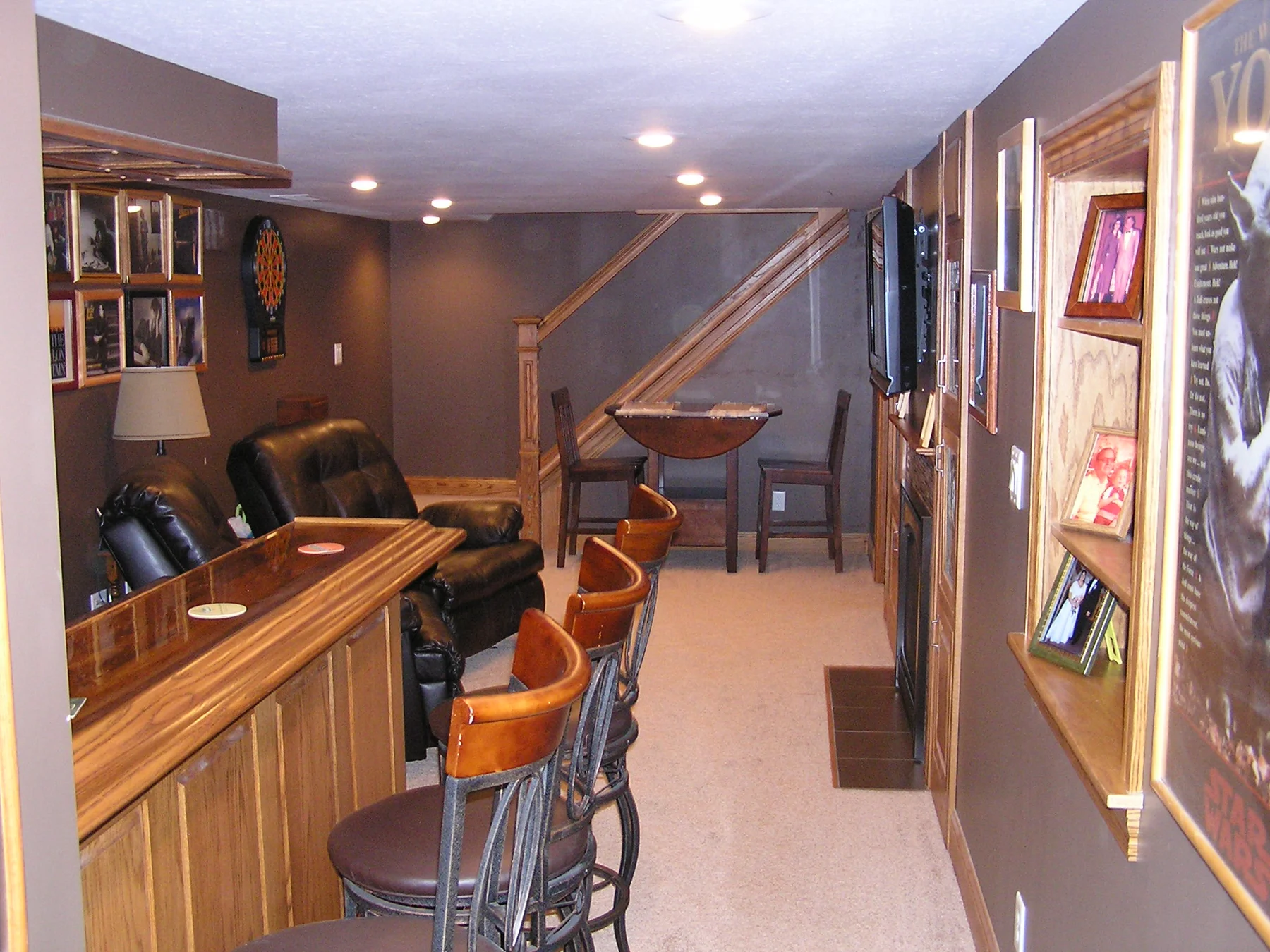 Custom wood bar and seating in the Cozy Basement project